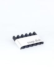Recycled PET soap dish in sepia black onda design. Made from sustainable materials, this soap dish features a wavy, textured surface for a modern, minimalist look.