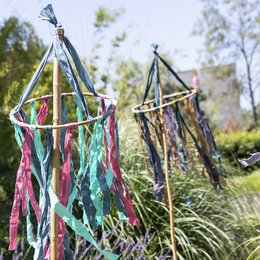 Colorful tassel mobile with khaki, blue, and pink tassels. Decorative party bunting for indoor or outdoor use.