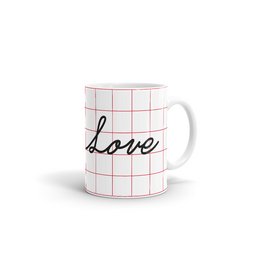 A white ceramic mug with the word "love" written in cursive script on a grid pattern background. The mug is a simple, minimalist design that would be suitable for everyday use or as a gift.