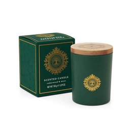  A tall, round green candle with a gold label featuring a sun design. The candle is described as "Cedarwood & Moss" scented and is part of the "Country Club" collection.