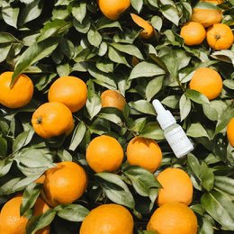  Sweet orange essential oil in 10ml/0.34oz bottle, made from fresh orange peels, with a warm, citrusy aroma.