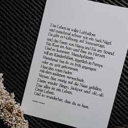 Artistic print featuring a hot air balloon design with German text. The print has a minimalist, abstract style.