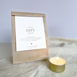  White bath bombs with floral design and "With Love" text on packaging.