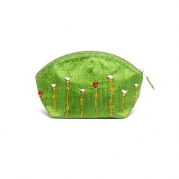 Green embroidered raw silk cosmetic bag with floral design.