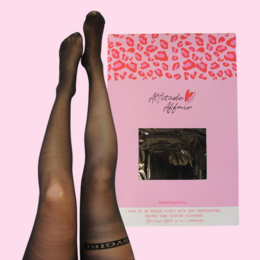 Black tights with a bold "Message on Tights" design, featuring a leopard print pattern in shades of red. The tights are 40 DEN and part of the "Statement Tights" collection.