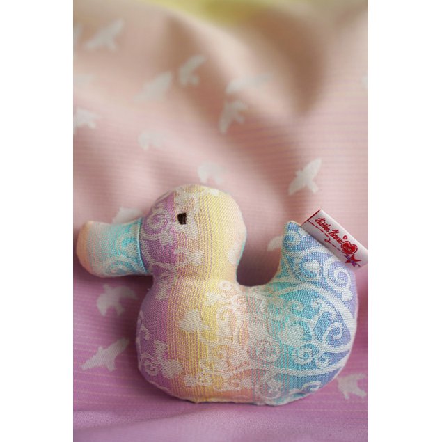 Clutching toy duck Marie in Wonderland