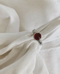 Red statement ring with gold plating, available in sizes 6, 7, and 8 (US).