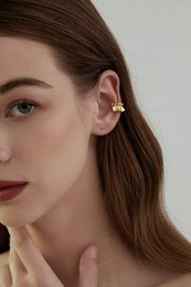 Polsino auricolare dal design unico della gonna: un pezzo