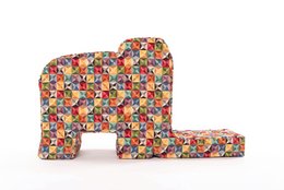 Colorful plush elephant toy with a playful, patterned design. Suitable for children to romp and play with.