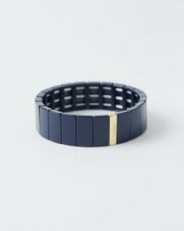 Navy blue beaded bracelet with gold accent, rectangular tile design, elastic stretch band, modern minimalist style.