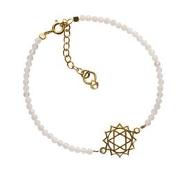 A delicate gold-tone charm bracelet featuring a heart chakra symbol and white beads, perfect for adding a touch of spiritual style to any outfit.