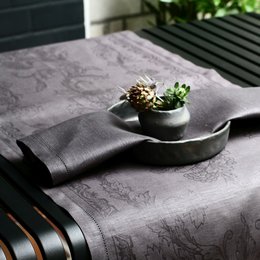 Linen runner in black color, featuring a textured, marble-like pattern. Suitable for use as a table runner or decorative piece.