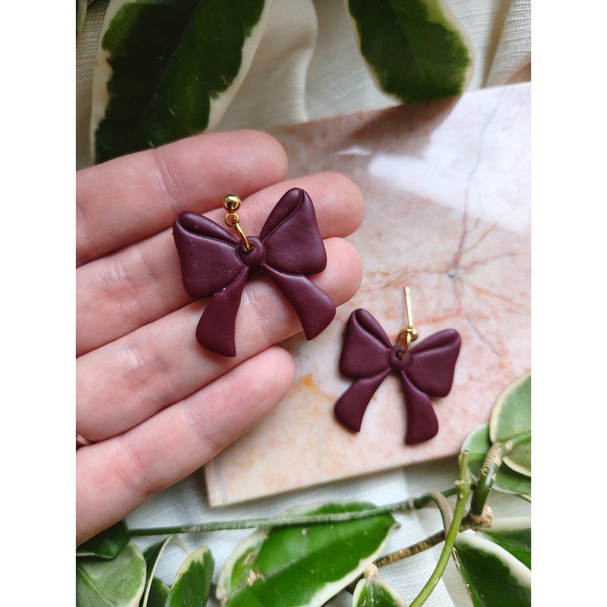 Boucles d'oreilles noeud bordeaux