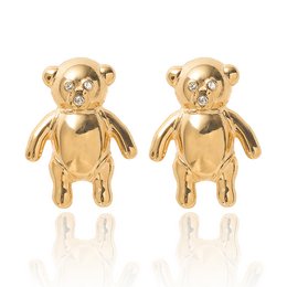 Adorable gold-toned teddy bear stud earrings with a cute and whimsical design, perfect for adding a touch of playful style to any outfit.