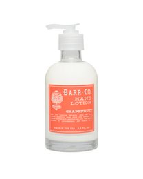 A duo of blood orange-scented hand soap and lotion in a sleek caddy. The soap and lotion feature a vibrant orange color and a refreshing blood orange fragrance.