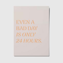 A6 postcard with the text "EVEN A BAD DAY IS ONLY 24 HOURS." in orange lettering on a light beige background.