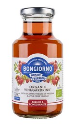Organic pomegranate and berry juice blend in a glass bottle with a silver cap. Vibrant red-orange color.