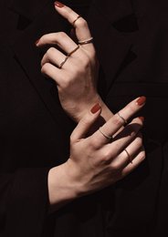 A simple, elegant silver ring. The ring has a smooth, rounded shape and a shiny, metallic finish. It is suitable for stacking with other rings or wearing alone as a minimalist accessory.