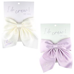 Large fabric bows, cream and lavender colors, "I do crew" text, hair accessories, decorative clips.