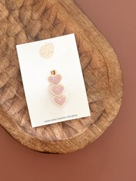  Soft pink heart-shaped hair clips for kids, made of a delicate material.