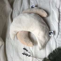 Soft, plush off-white velour hot water bottle for babies. Provides gentle warmth and comfort.