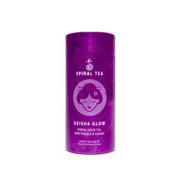 Geisha Glow is a premium loose leaf tea with a vibrant purple packaging. The tea leaves are dark green in color and appear to be of high quality.