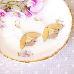 Gold and pink leather drop earrings with a ginkgo leaf design.