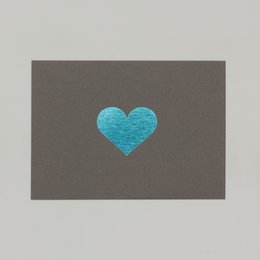 Turquoise heart-shaped card for love and romance. Elegant and minimalist design with a vibrant blue heart on a dark gray background.