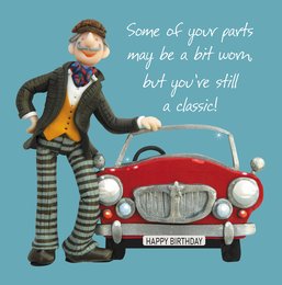 A birthday card featuring a whimsical character standing next to a vintage red car with the text "Some of your parts may be a bit worn, but you're still a classic!"