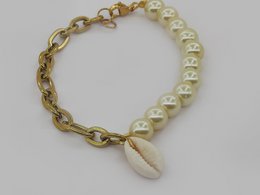%2376 Cowrie shell pearl bracelet
