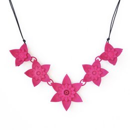 A vibrant fuchsia-colored necklace featuring 5 large flower-shaped charms.
