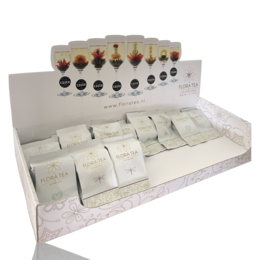 White counter display with various storage boxes in different shapes and colors.