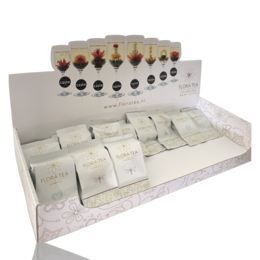 White counter display with various storage boxes in different shapes and colors.