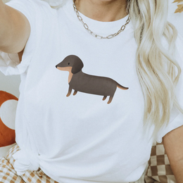 A white organic cotton t-shirt with a strawberry botanical print design. The shirt has a relaxed, cottagecore style.