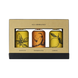  Coratina olive oil gift box set with illustrated female portraits, warm earth tones, premium glass bottles, elegant packaging.