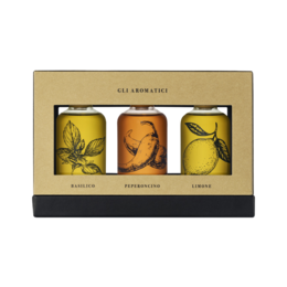 Coratina olive oil gift box set with illustrated female portraits, warm earth tones, premium glass bottles, elegant packaging.