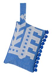 A blue clutch bag with a white floral pattern and pom-pom trim. The clutch has a simple, elegant design and is suitable for casual or formal occasions.