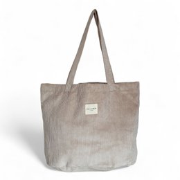 Beige shoulder bag with ribbed texture and leather handles. Stylish and practical tote bag for everyday use.