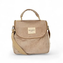  Beige corduroy lunch box with a top handle and zipper closure. Features the Delsey brand name.