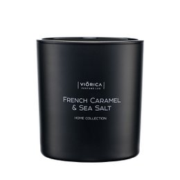 A tall, round black candle with the scent of French caramel and sea salt.