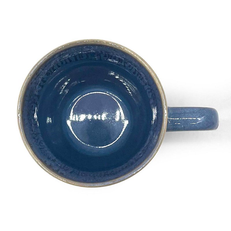 Stoneware mug with blue handle