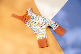 "Orange and white baby romper with marine life print, short sleeves, colorful ocean animals design"