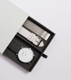 Classic silver and black watch set with minimalist design and leather strap.
