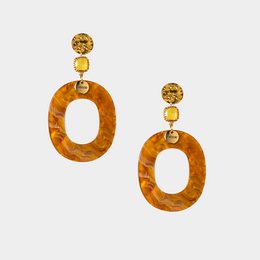 Oval-shaped statement earrings with a warm, amber-like color and gold-tone accents.
