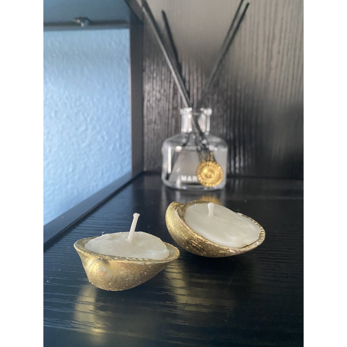 Goldene Muschelkerzen