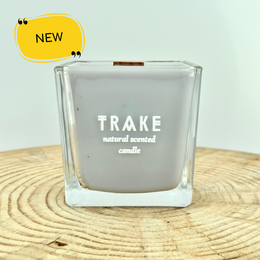 Luxury natural candle with a wooden wick, scented with Cuban tobacco and oak, handcrafted in a square glass container.