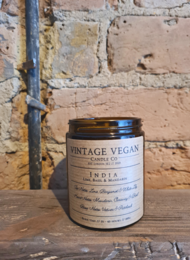 Vintage vegan soy travel candle with lime, basil, and mandarin scents. Comes in a glass jar with a metal lid.