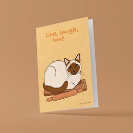  Greeting card with an illustration of a Siamese cat lounging on a branch, with the text "Live, laugh, loaf" printed on the card.