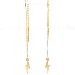 Gold-tone lightning bolt pendant earrings with a modern, minimalist design. Made of high-quality materials for a durable and stylish look.