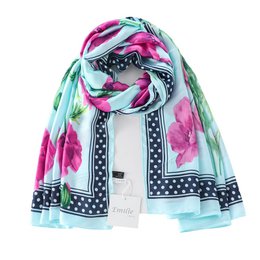  Soft, silky scarf with vibrant floral and striped patterns in shades of pink, green, and black. Versatile accessory that can be worn in various ways to complement different outfits.